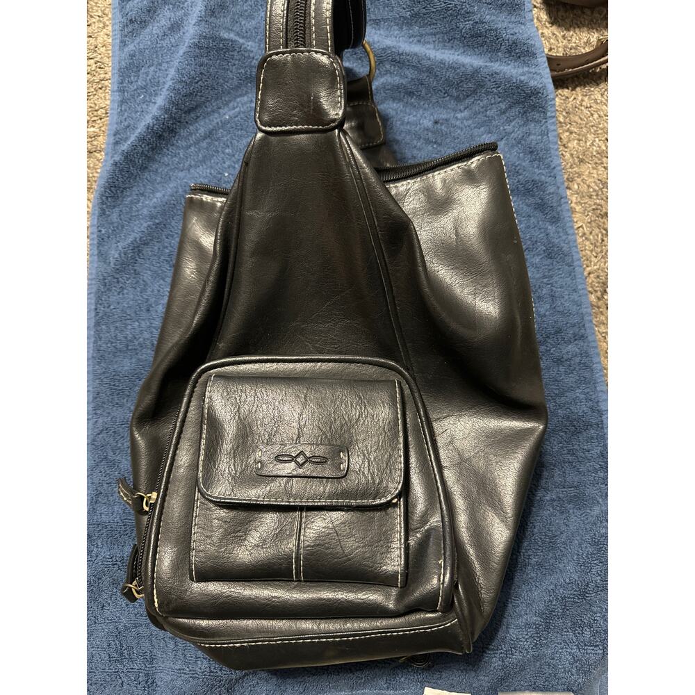 Unbranded Black crossbody purse or mini backpack. Stitching around zipper flawed